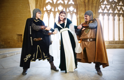 Two men enacting as warriors pulls female actor as princess emotion in acting