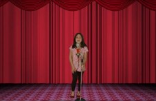 Girl is singing on stage
